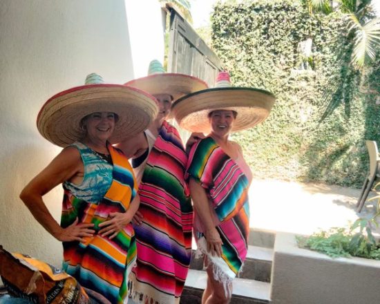 Casa de Sofia guests posing in traditional Mexican hats