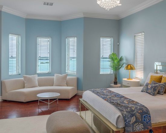 Blue Island Villa blue bedroom with curved sofa