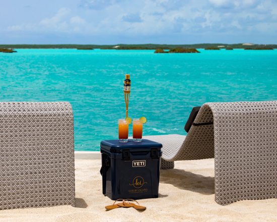 Blue Island Villa view from the beach with cooler and comfy lounge chairs