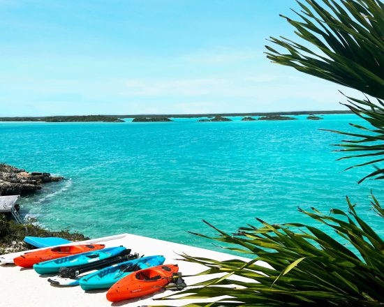 Blue Island Villa water view with colorful kayaks