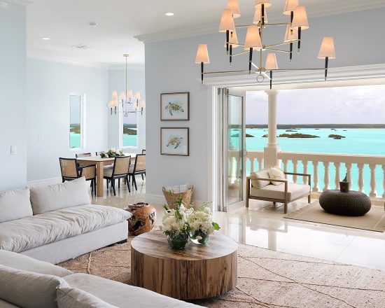 Blue Island Villa main living room with open doors and beautiful view of the blue water