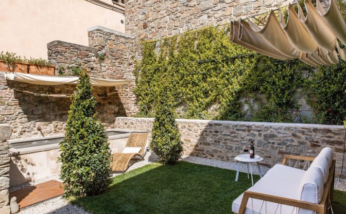A view of the courtyard seating area at Bella Aura