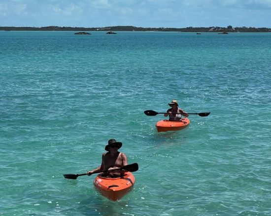 Blue Island Villa guests kayaking on Chalk Sound
