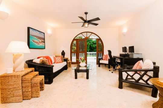 Bonus room at Cabarete Dreams, featuring multiple seating options and side tables