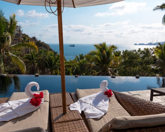 Casa de Sofia view over the infinity pool with ship in the water behind