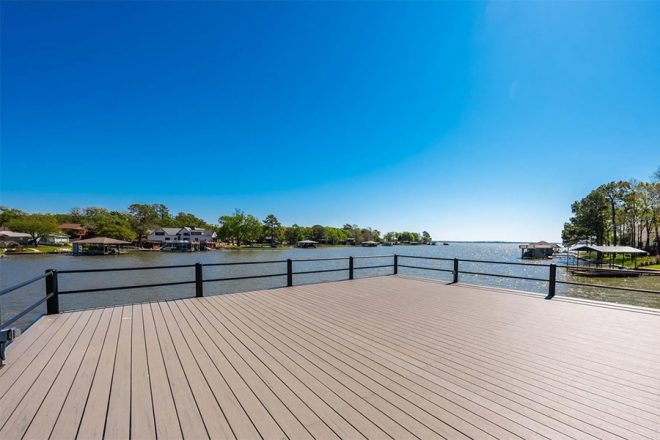 View from the upper deck space on the Cedar Creek dock. It's an open deck with a railing and lovely views of the water.