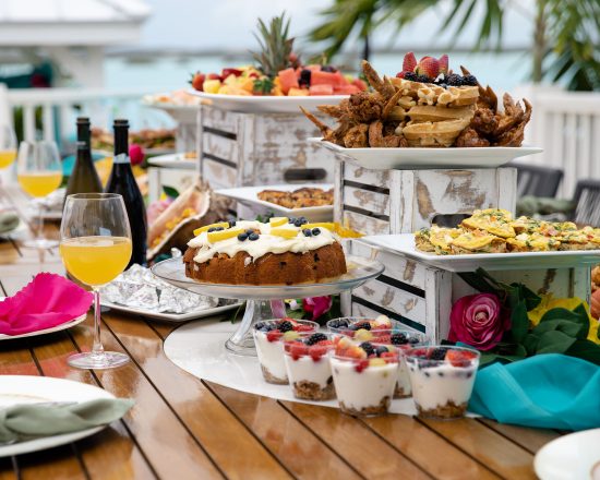 Blue Island Villa outdoor brunch spread with waffles, mimosas, coffee cake, yogurt parfaits and more