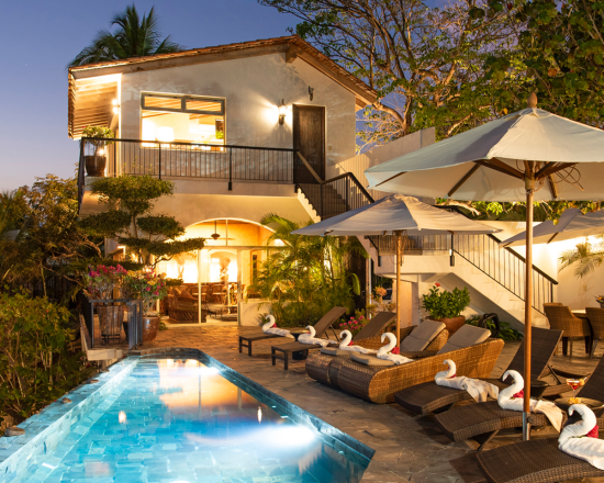 Casa de Sofia pool, lit up at night